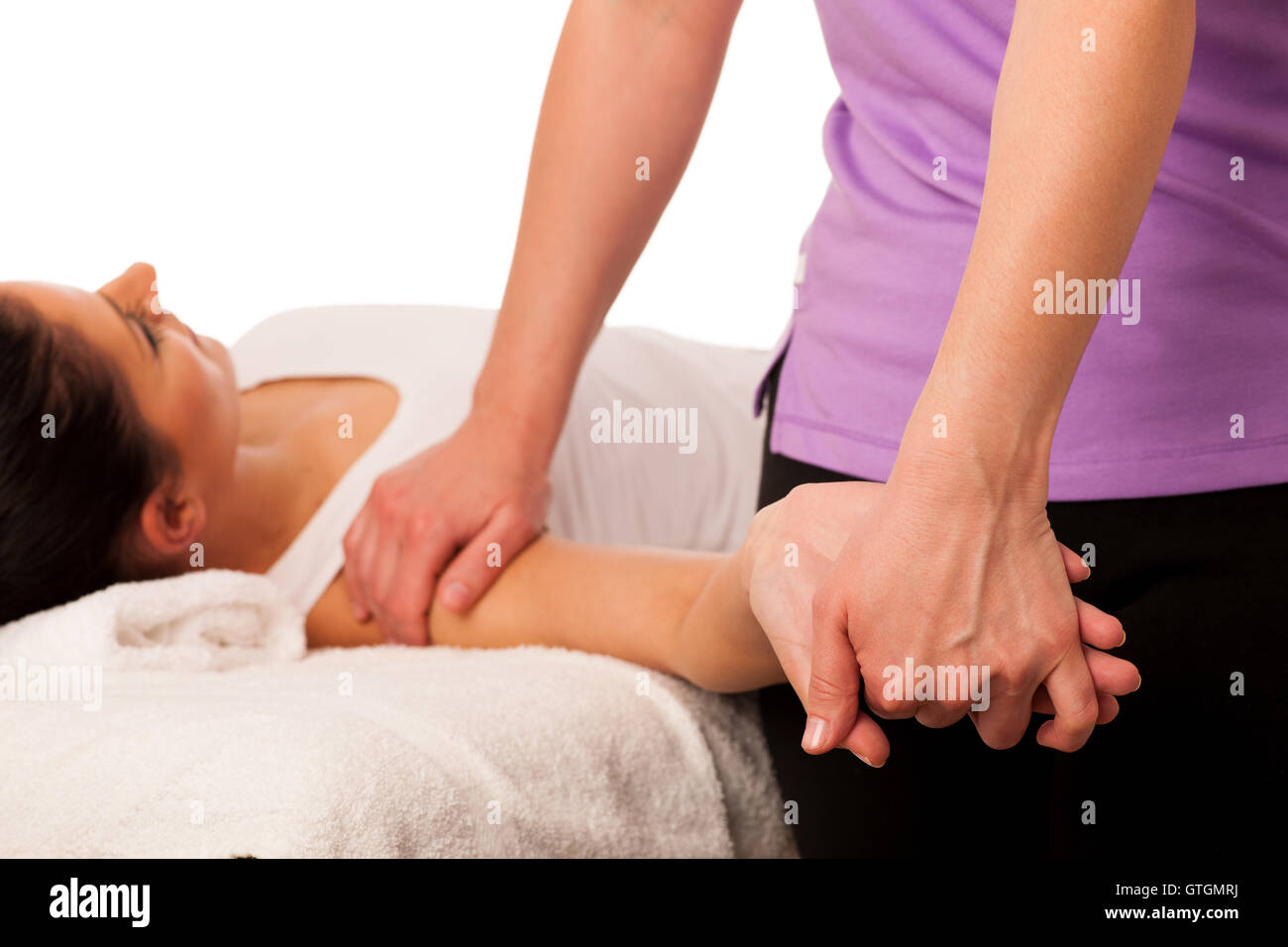 physiotherapy -therapist excercising with patient , working on arm stretching Stock Photo