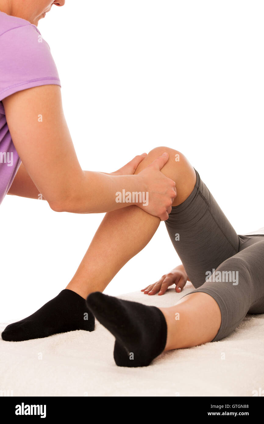 physiotherapy -therapist excercising with patient , working on leg stretching Stock Photo