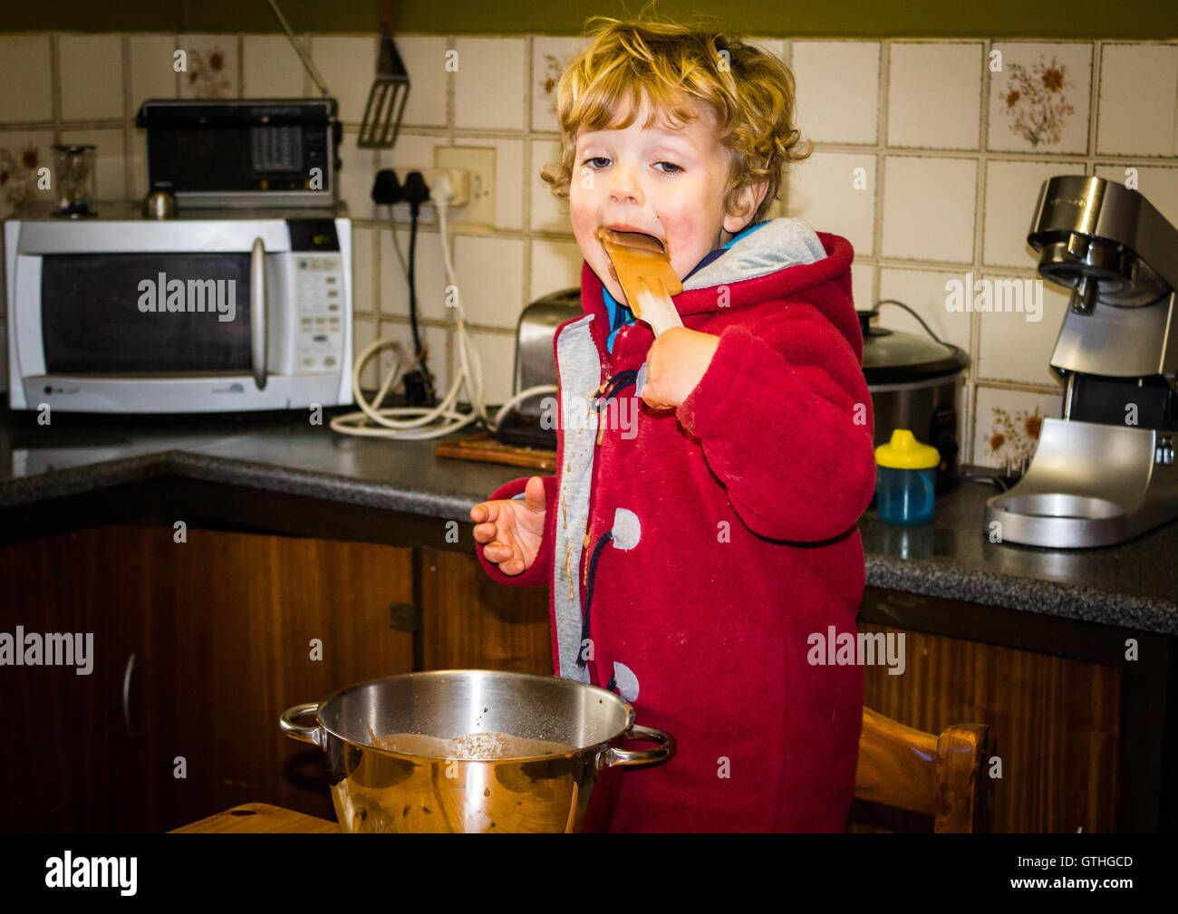 Child licking spoon hires stock photography and images Alamy