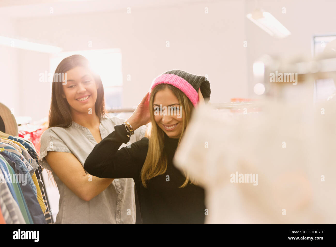 Fashion buyers trying on stocking cap Stock Photo