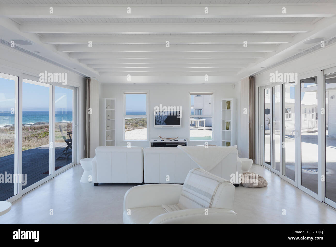 White living room in home showcase beach house Stock Photo - Alamy