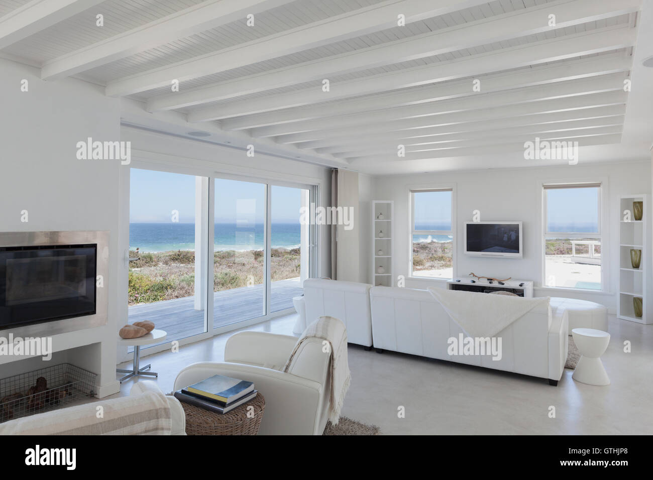 Beach house living room with wood beam ceilings Stock Photo