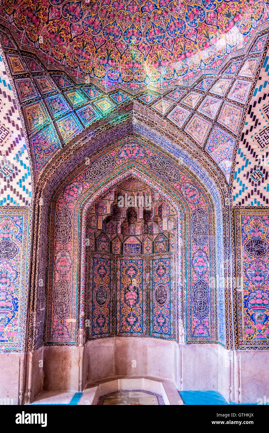 The Nasir ol Molk Mosque is a traditional mosque in Shiraz, Iran. The mosque includes extensive colored glass in its facade, and displays other traditional elements such as the Panj Kāse ("five concaved") design. It is named in popular culture as the Pink Mosque, due to the usage of considerable pink color tiles for its interior design. Stock Photo