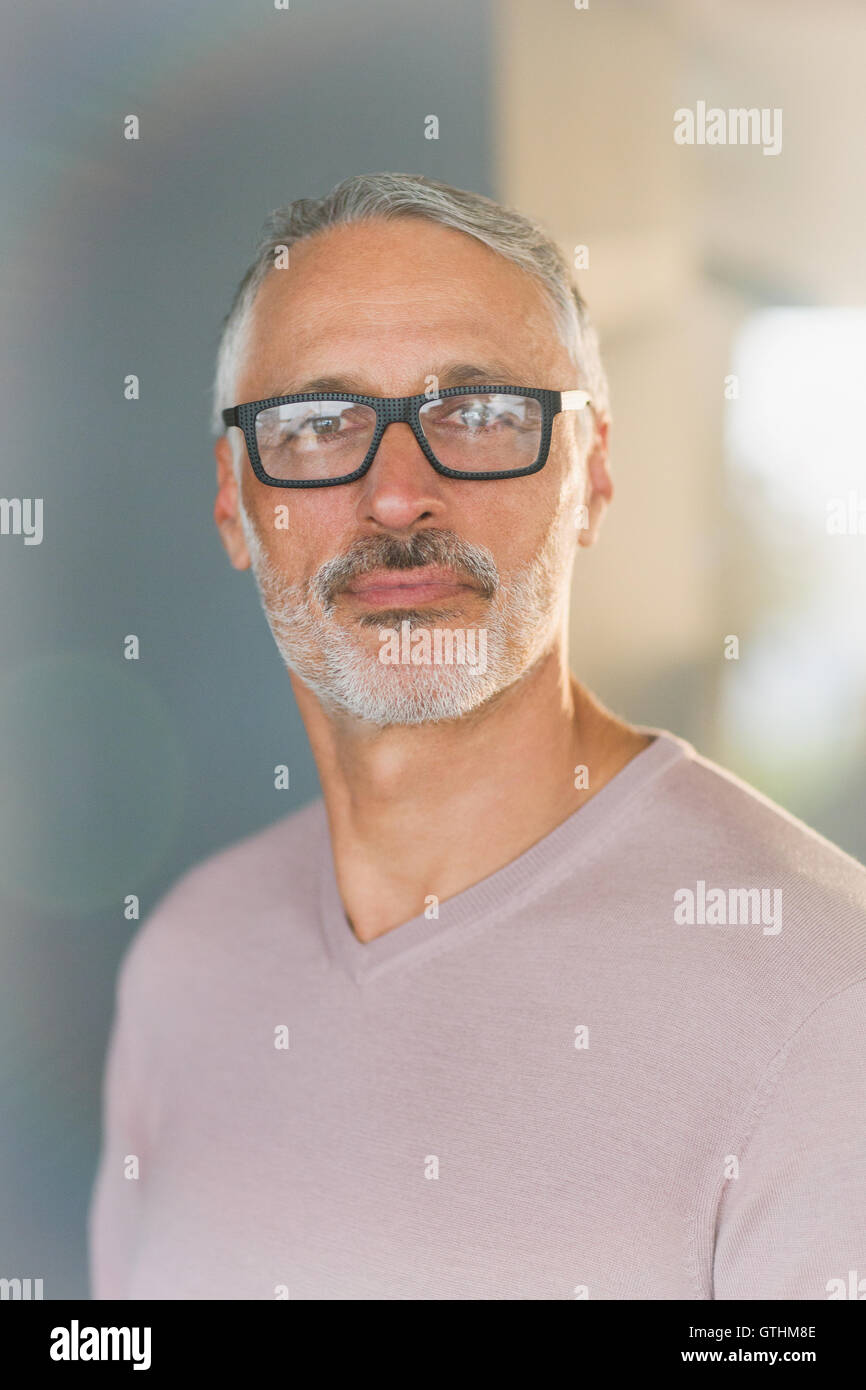 Portrait confident businessman with beard and eyeglasses Stock Photo