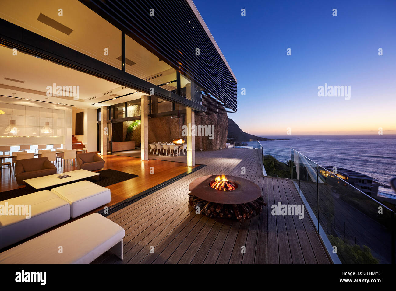 Fire pit on modern luxury home showcase beach house at sunset Stock Photo