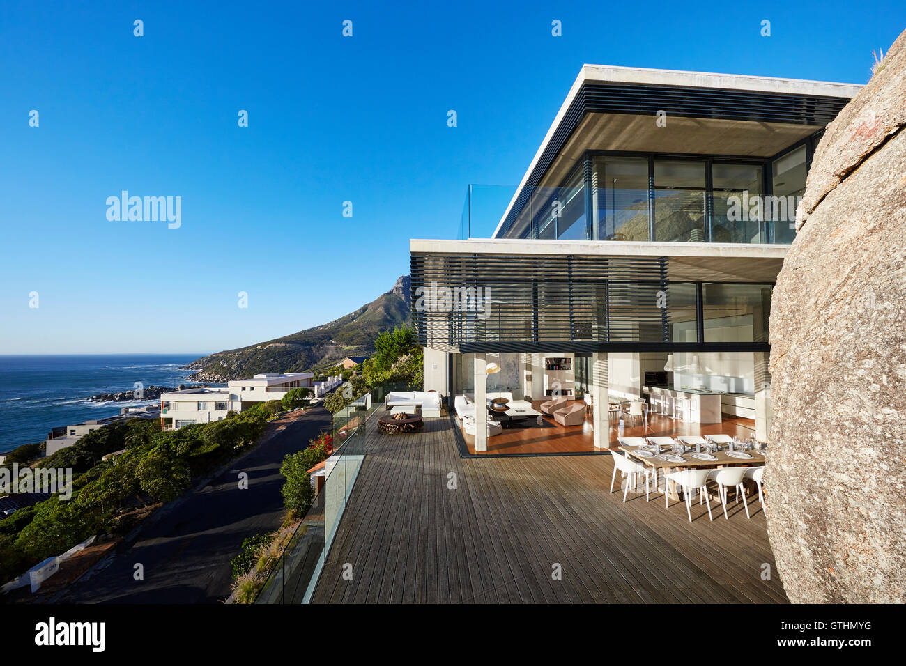 Modern luxury house and patio with ocean view under sunny blue sky ... - Private Outdoor Spaces Luxury Condos With Ocean View