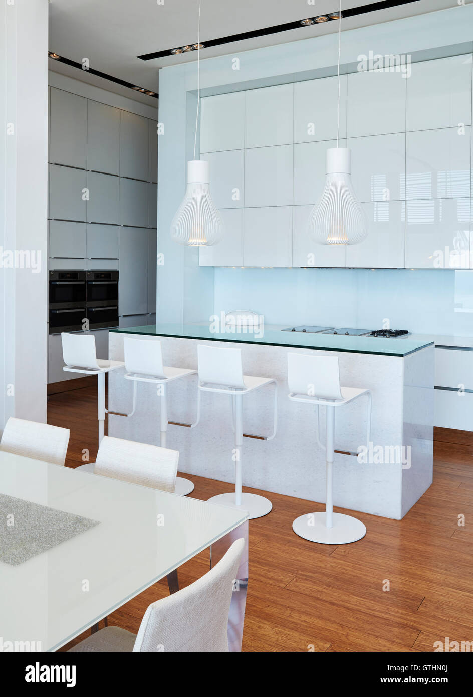 Modern white home showcase kitchen with breakfast bar Stock Photo
