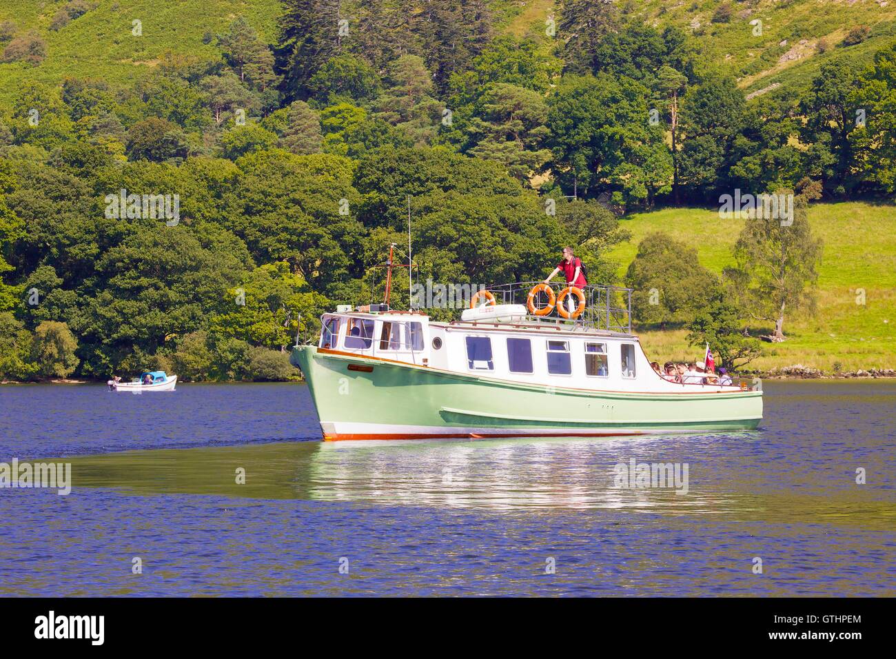 Tourists enjoying a cruise aboard an Ullswater Steamer. Ullswater, Penrith, The Lake District National Park, Cumbria, England. Stock Photo