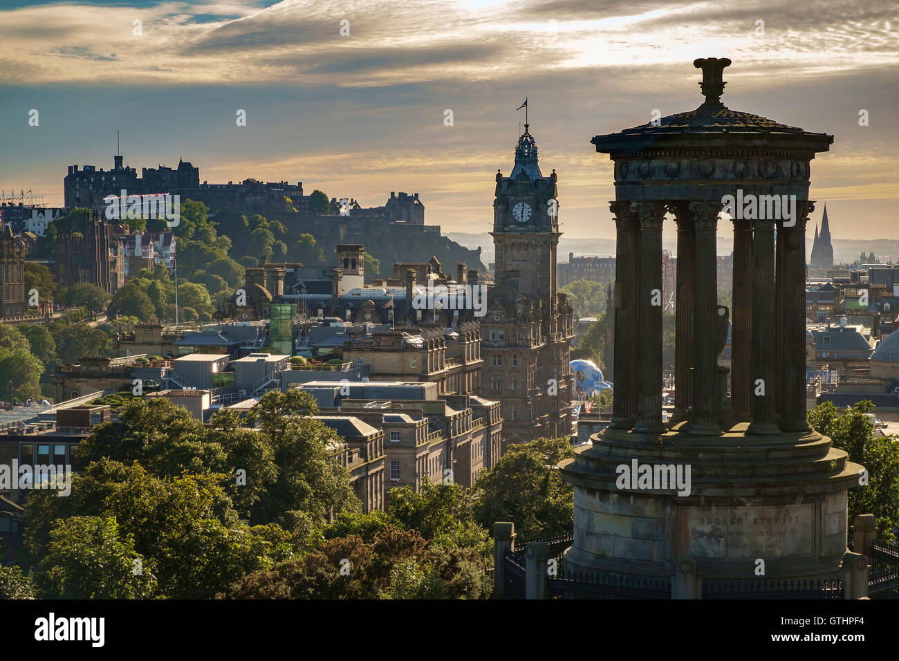 Dugald Stewart monument, Balmoral Hotel Clock Tower and the Castle, Edinburgh, Scotland. Stock Photo