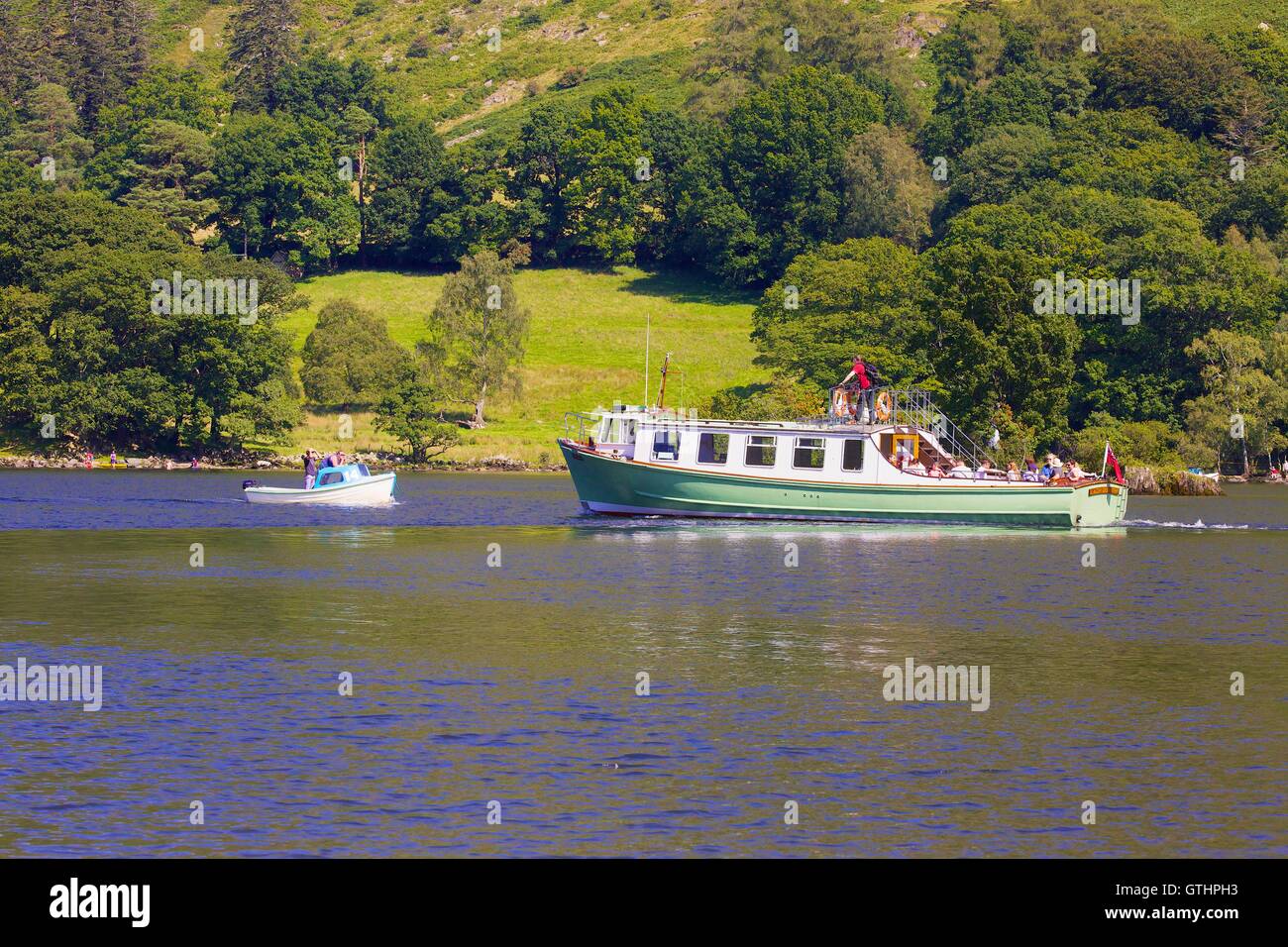 Tourists enjoying a cruise aboard an Ullswater Steamer. Ullswater, Penrith, The Lake District National Park, Cumbria, England. Stock Photo