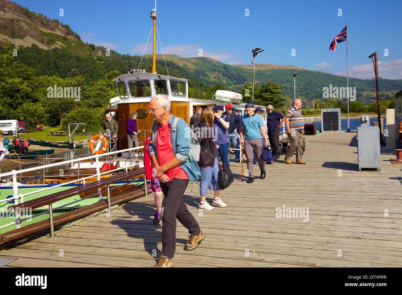 Tourists disembarking a cruise from Ullswater Steamer. Glenridding Pier, Ullswater, Penrith, The Lake District National Park, UK Stock Photo