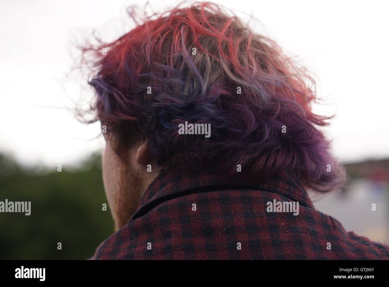 Photo of dyed ombre red and purple hair, punk/emo style Stock Photo