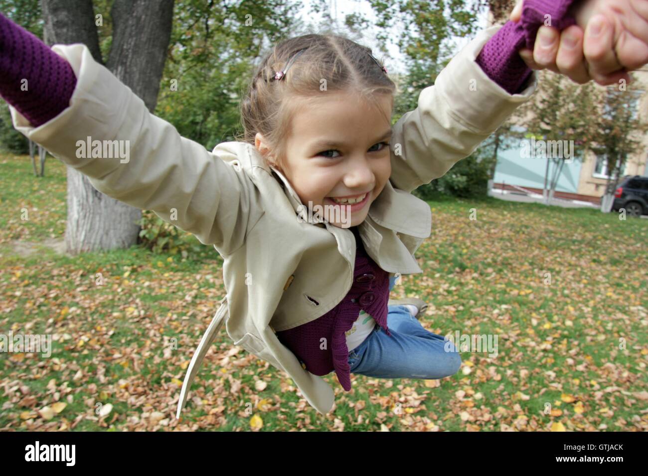 little girl in the autumn park Stock Photo - Alamy
