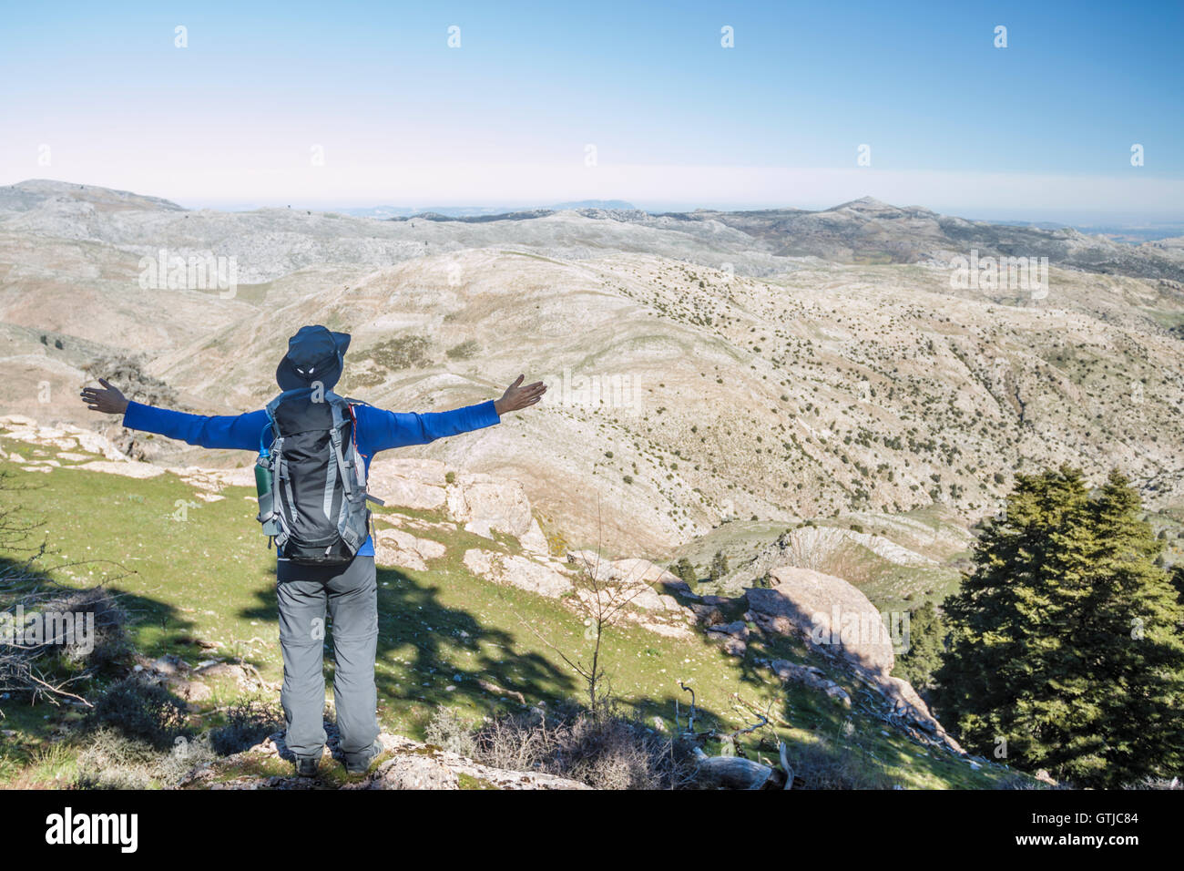 Happy man with raised arms at the mountain. Enjoying the nature Stock ...