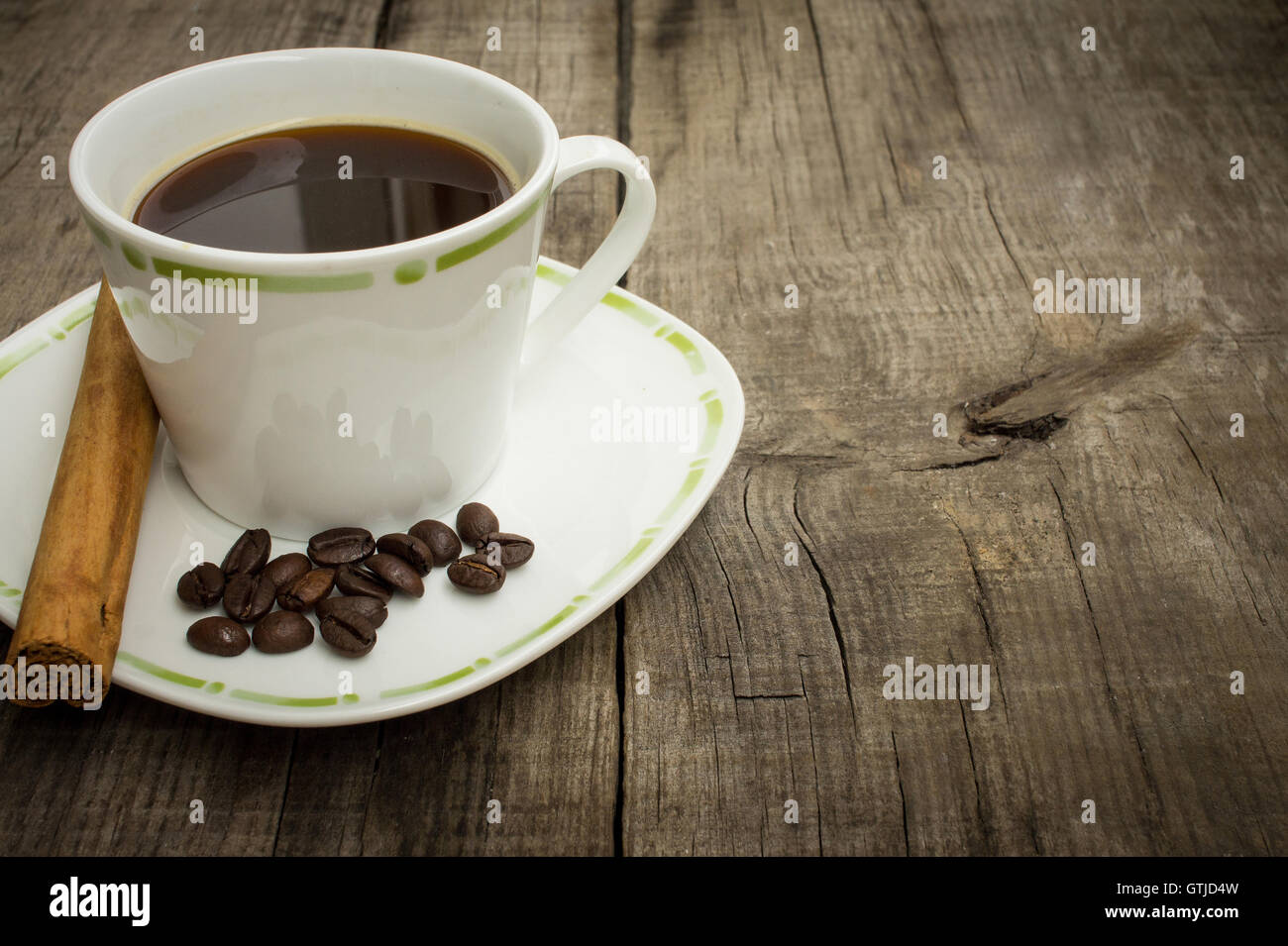 Coffee Cup with beans and cinnamon stick Stock Photo
