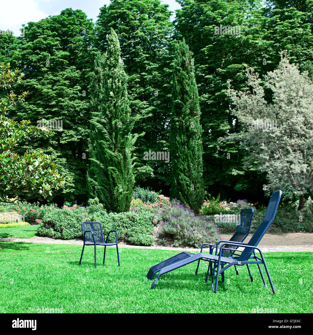 Chaise lounge on the green grass Stock Photo Alamy