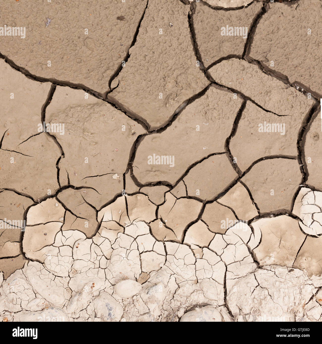 Cracked dry earth drought concept background Stock Photo - Alamy