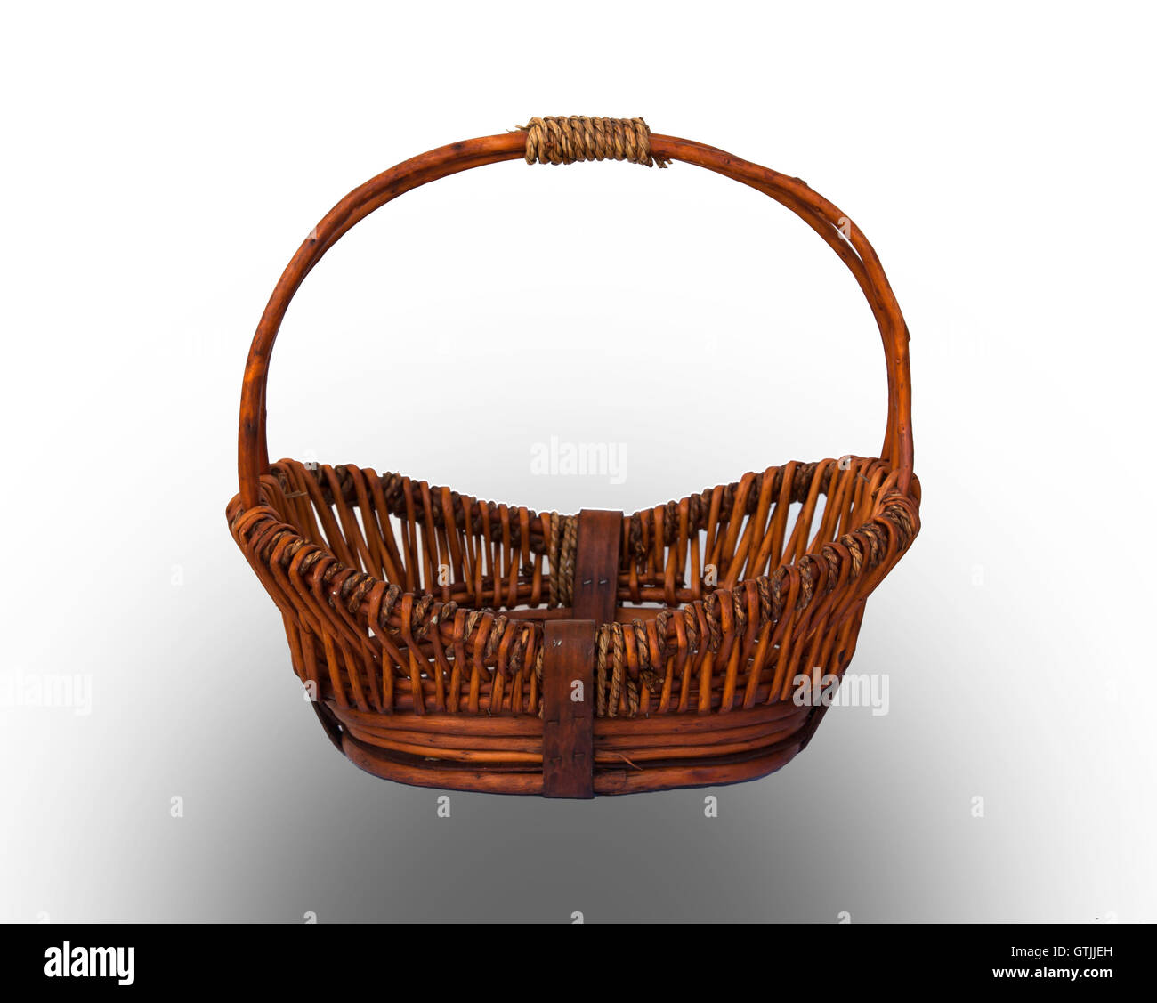Round brown wicker basket with handle Stock Photo Alamy