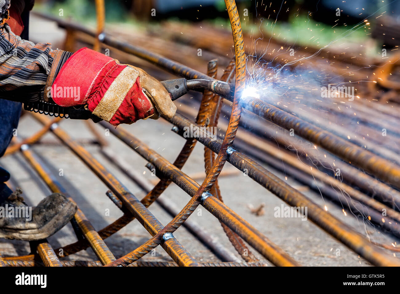 Close up of the hands welder worker with electrode. selective focus Stock Photo