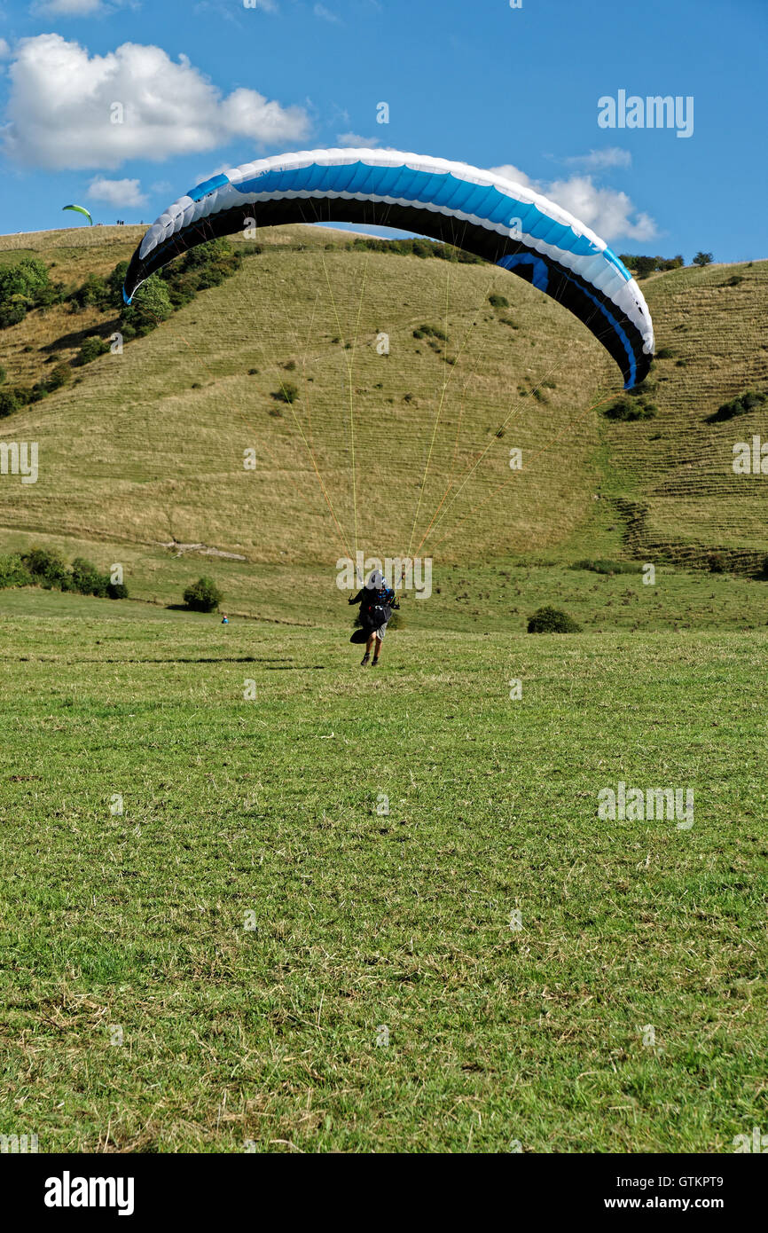 hang glider landing in green field Stock Photo Alamy