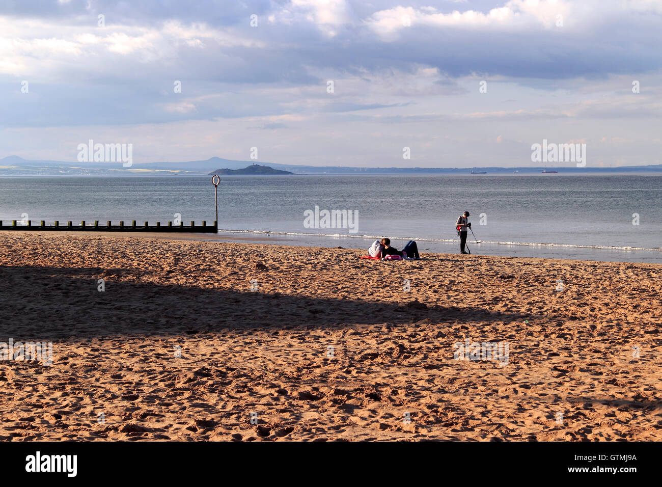 People relaxing on a beach, Portobello, coastal suburb of Edinburgh ...