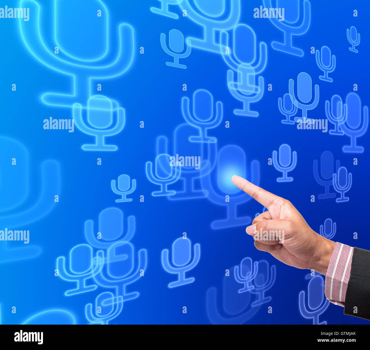 Hand pushing microphone button on a touch screen interface Stock Photo