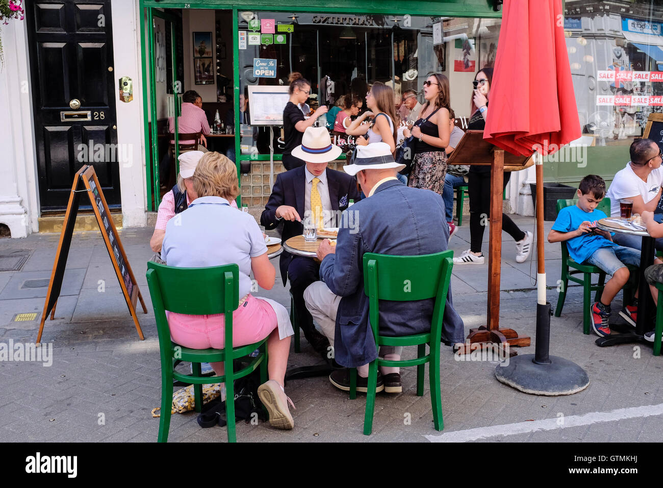 Diners outside cafe, Museum street, Bloomsbury, London, UK Stock Photo