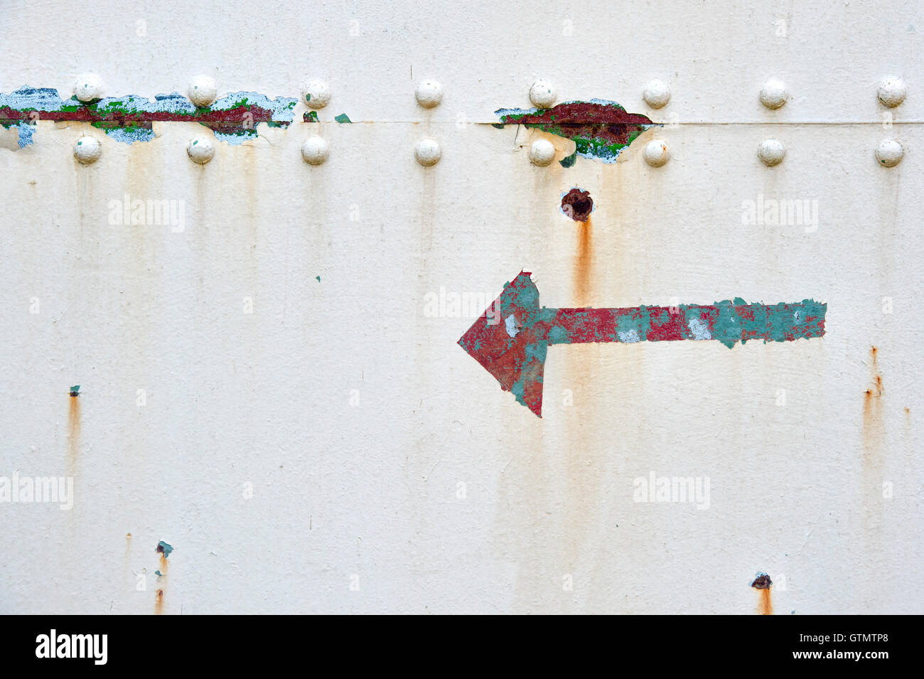 Peeling paint rust and rivets texture. Old metal garage door Stock