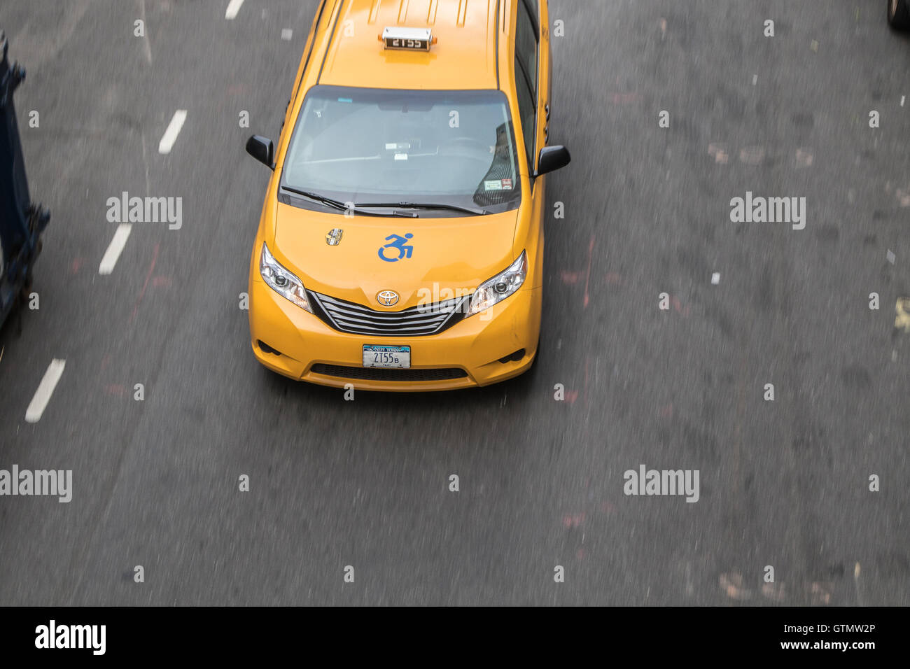 A yellow cab minivan in New York City Stock Photo