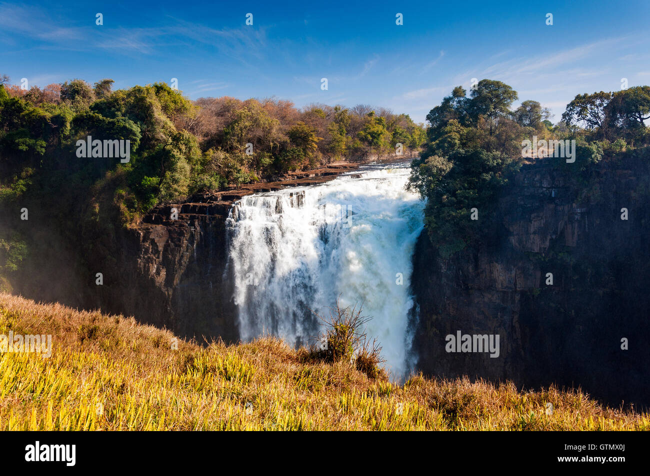 View of the Victoria Falls in Zimbabwe, Africa; Concept for travel in Africa Stock Photo