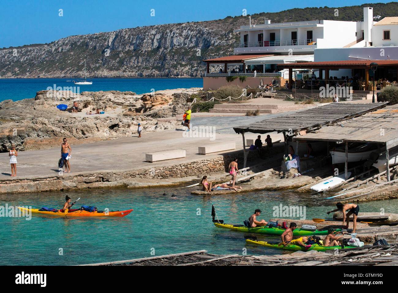 Kayak in Es Calo de San Agusti beach, Formentera Island, Mediterranean sea, Balearic Islands, Spain. Can Rafalet Restaurant. Es Stock Photo