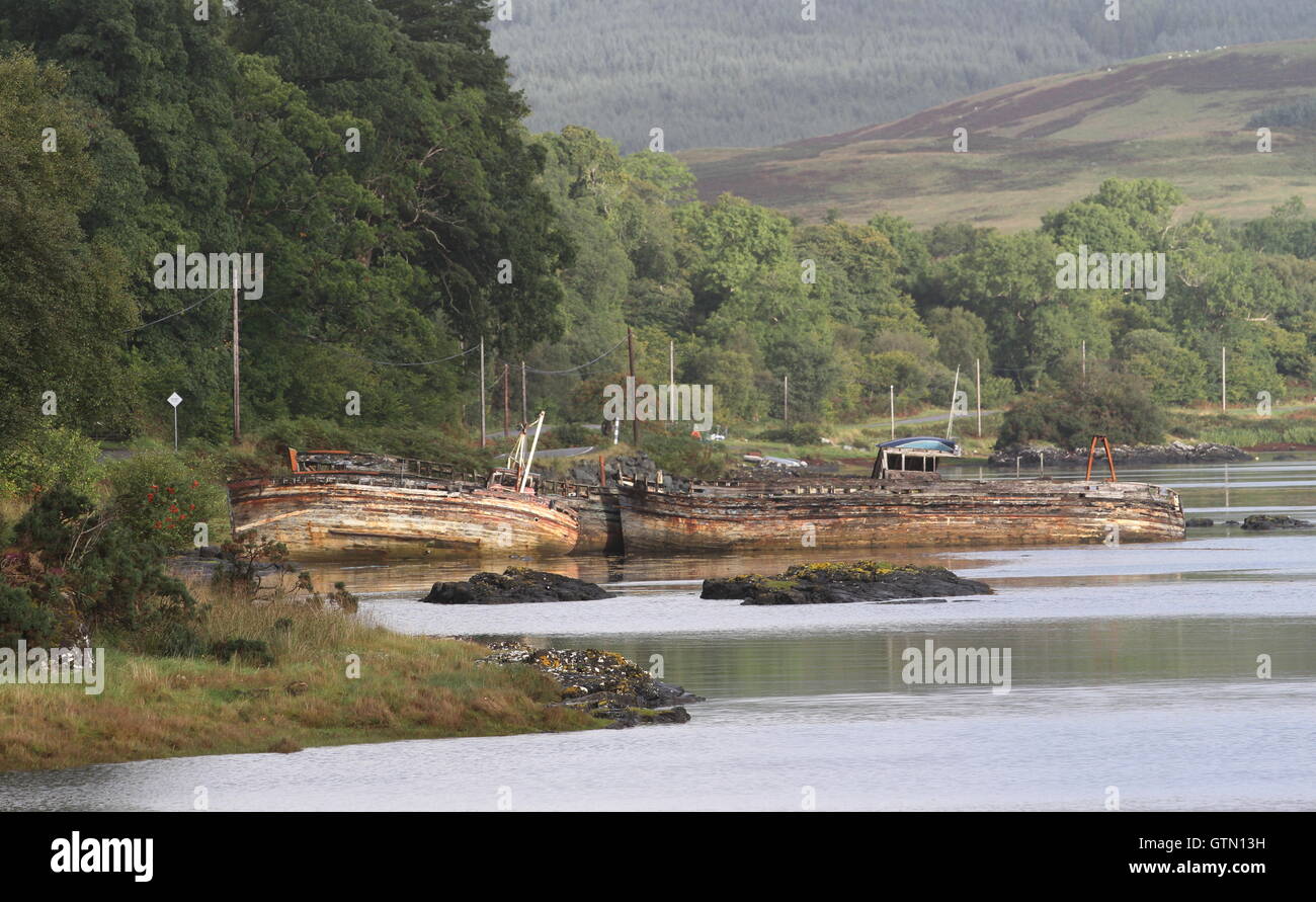 Derelict boats near Salen at high tide Isle of Mull Scotland September