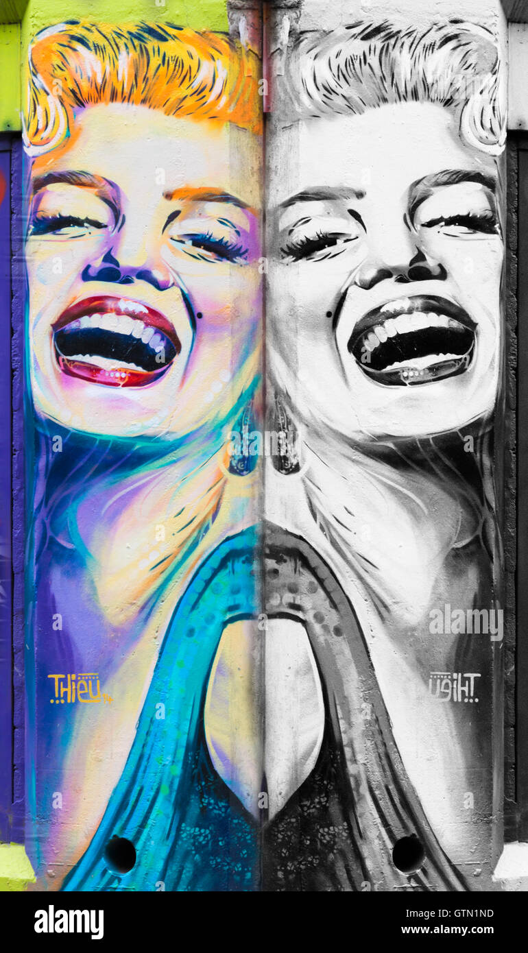 colour and B&W adaption of mural graffiti of Marilyn Monroe by Stef Thieu on wall at Shoreditch, London in September Stock Photo