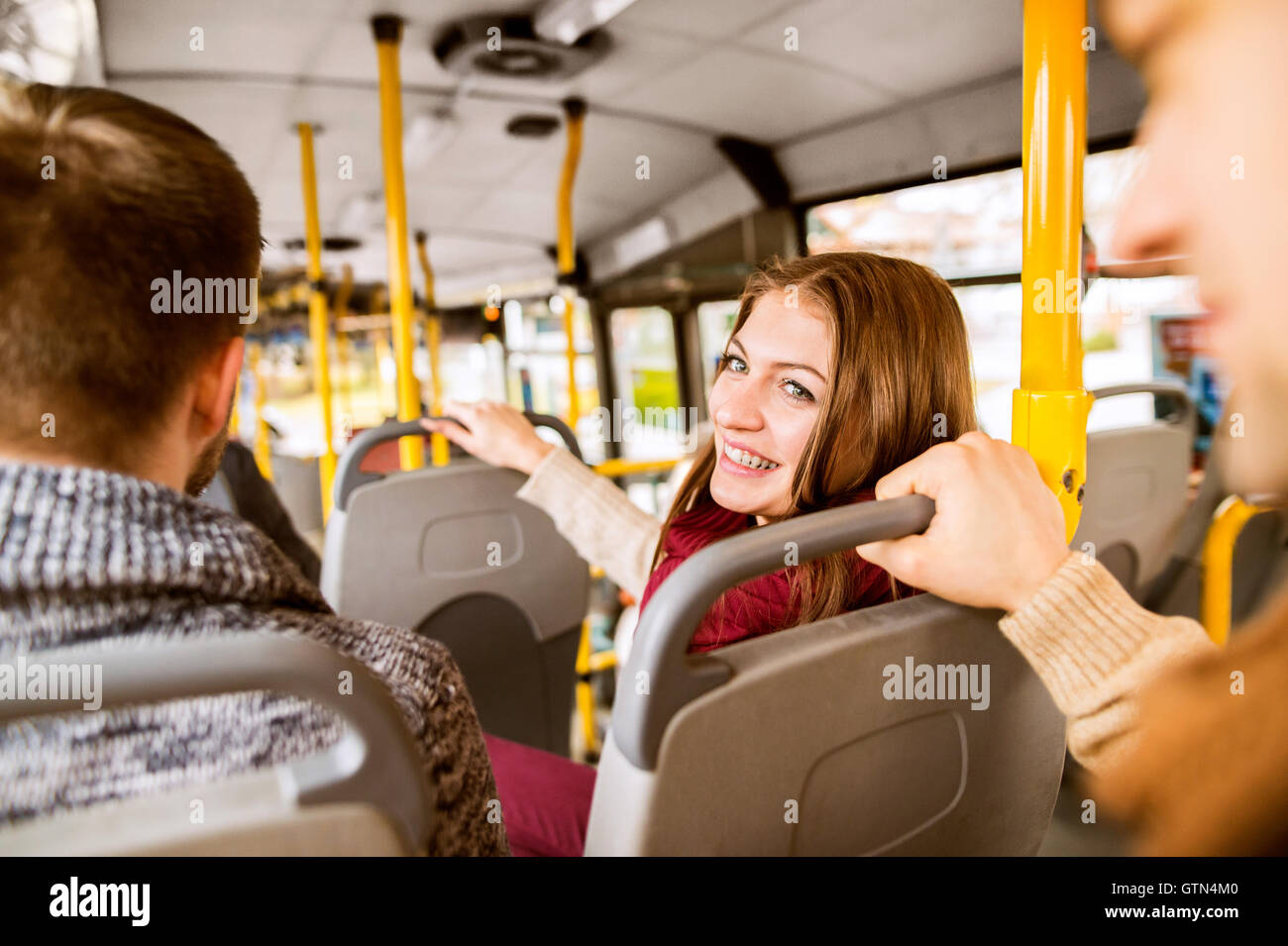 Beautiful young woman traveling by bus, having fun Stock Photo - Alamy