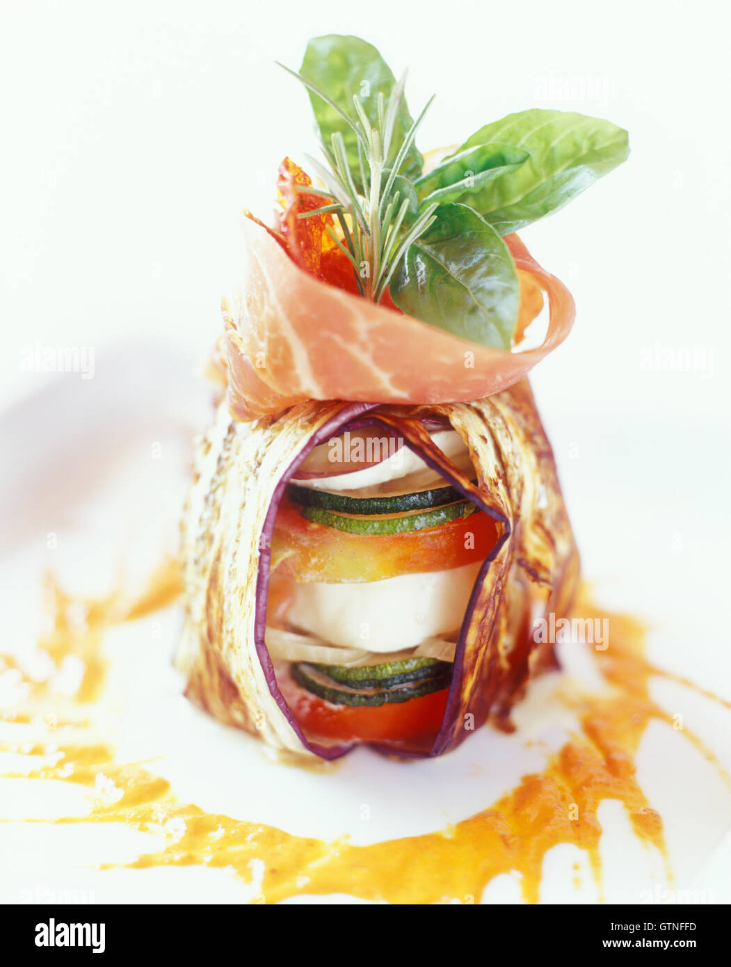 Basil, grilled vegetables tossed with Mozzarella cheese, Serrano ham, and a sweet piquillo pepper vinaigrette. Santo Domingo, Dominican Republic. Stock Photo