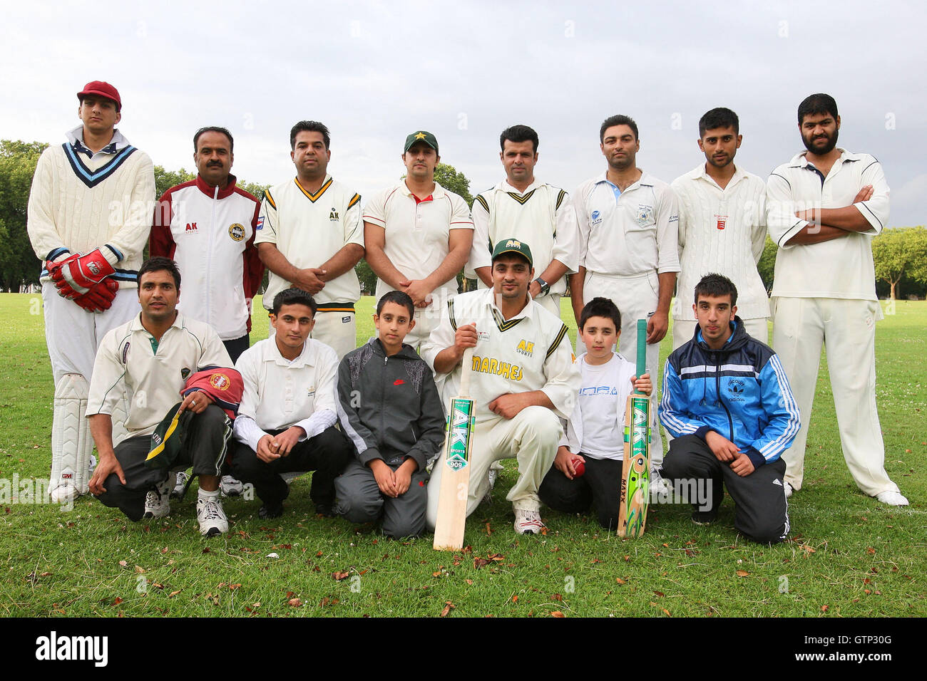 International cricket upmire Aleem Dar (4th R) is pictured with members of The Ducks Cricket Club only a few days after officiating in the first Ashes Test at Cardiff - The Ducks CC vs Island Community CC - Victoria Park Community Cricket League - 15/07/09 Stock Photo
