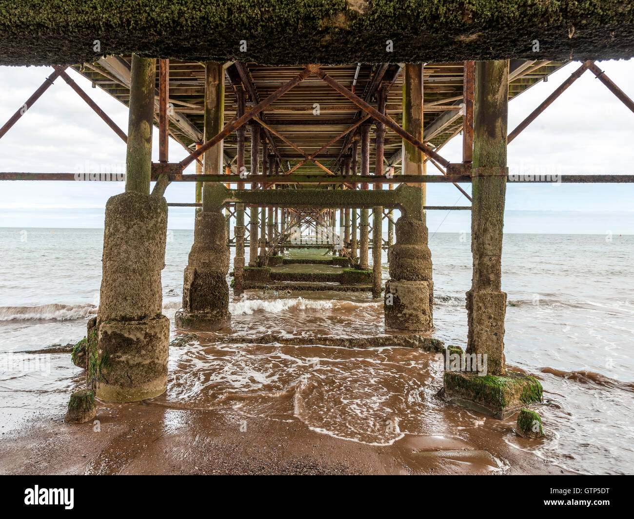 Landscape depicting the seashore along Teignmouth beach at Teignmouth, with views of the Grand Pier Structure. Stock Photo