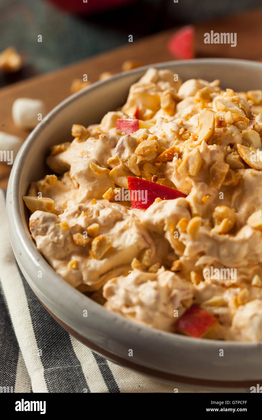 Homemade Sweet Candy Apple Salad with Peanuts and Marshmallows Stock Photo