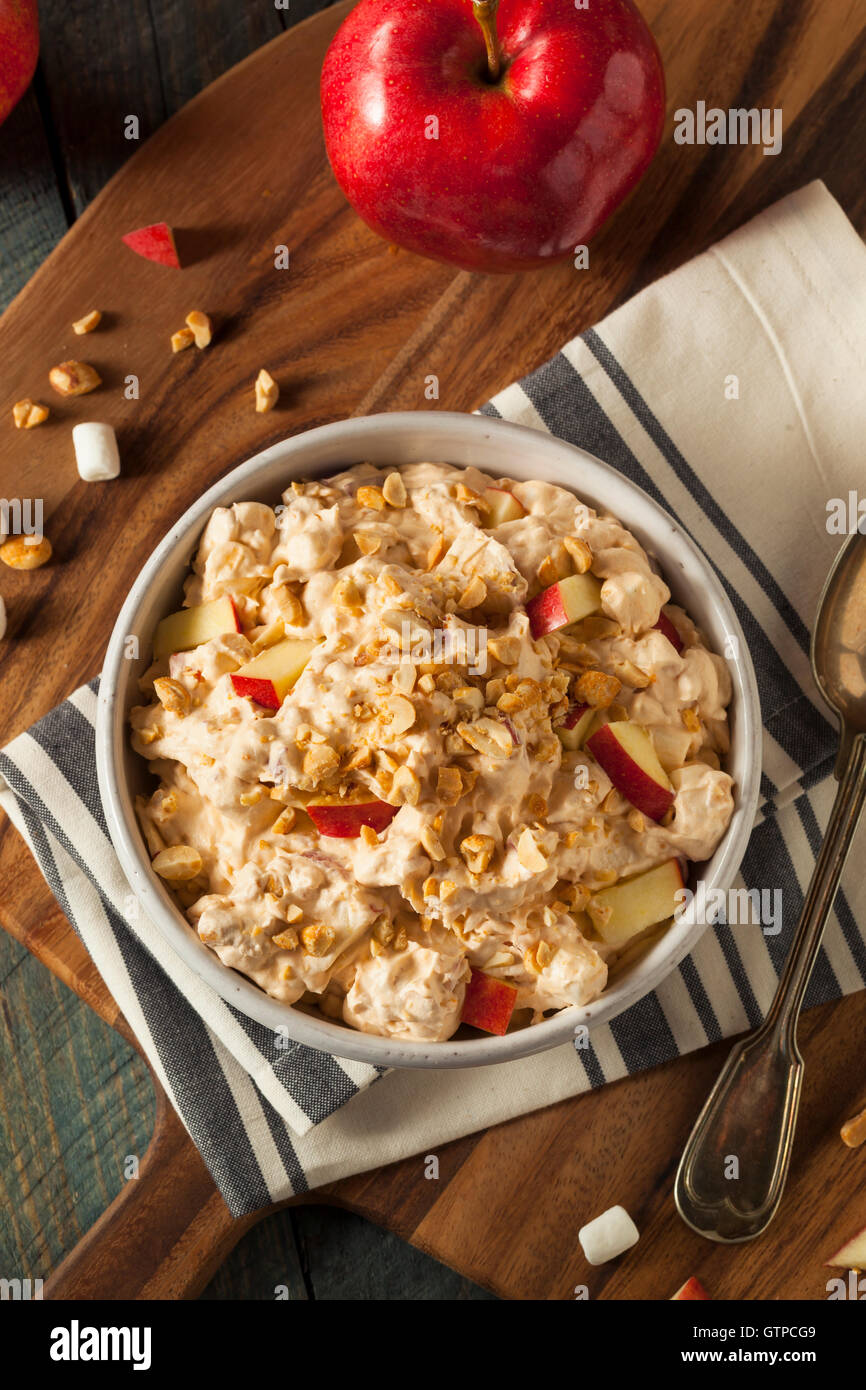Homemade Sweet Candy Apple Salad with Peanuts and Marshmallows Stock Photo