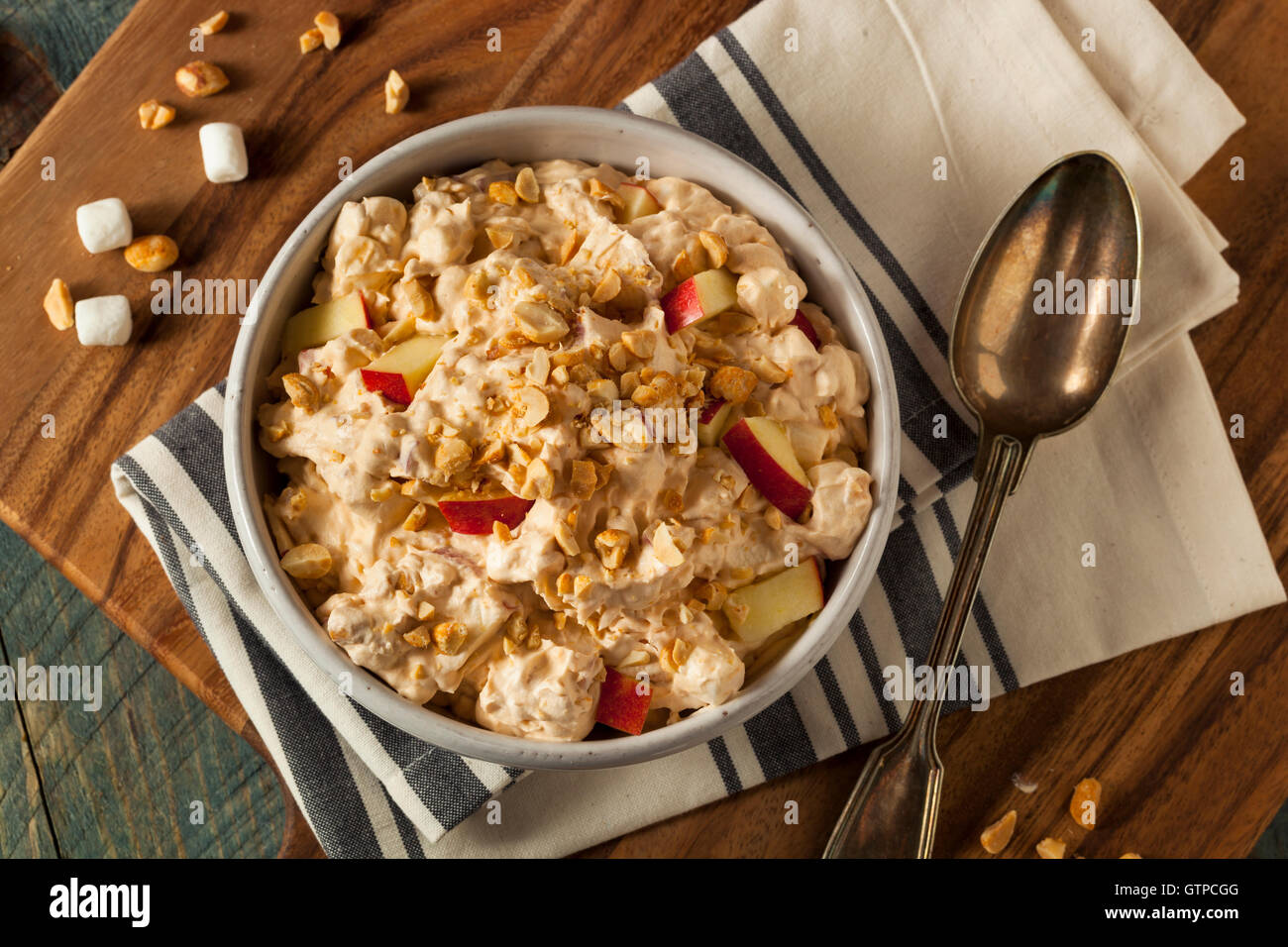 Homemade Sweet Candy Apple Salad with Peanuts and Marshmallows Stock Photo