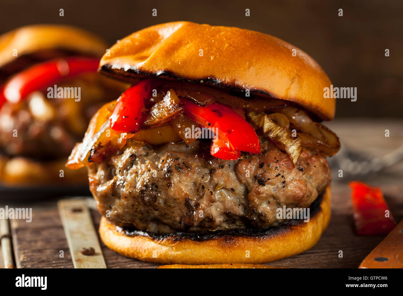 Homemade Sausage Burger with Onions and Peppers Stock Photo