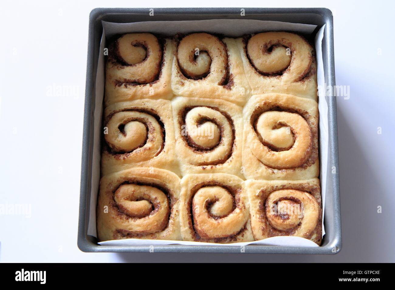 Cinnamon rolls in cake tin Stock Photo