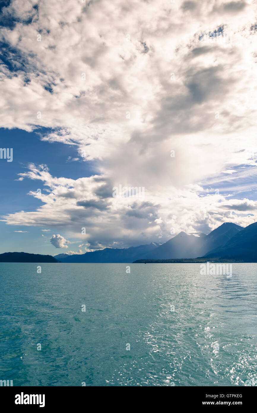 Dramatic storm clouds with a rain shower over the mountains in the ...