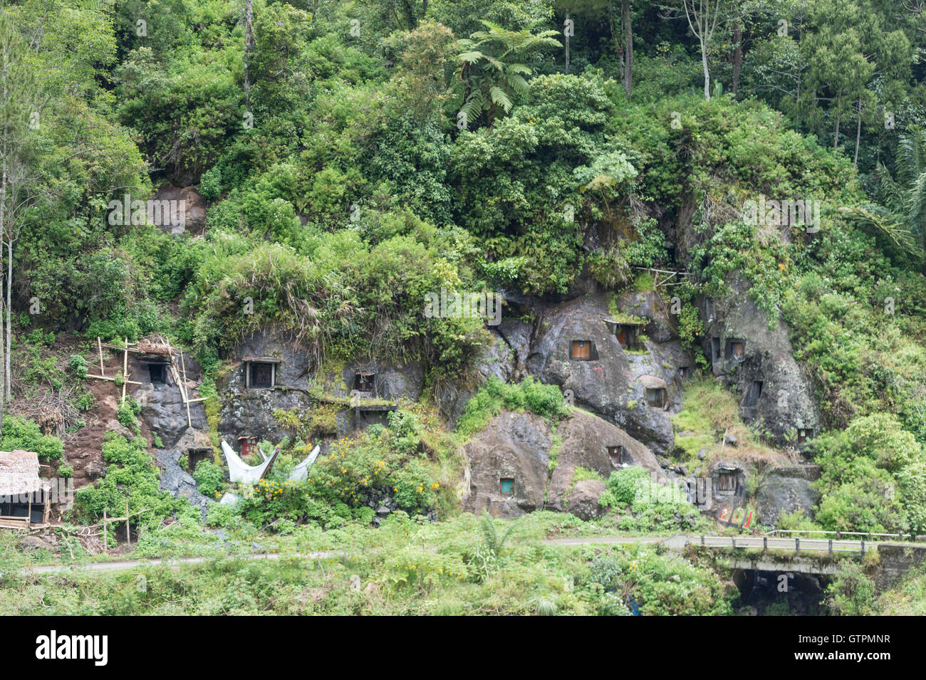 Buried In Rocks Stone Graveyard or burial site with coffins placed in caves carved into ...