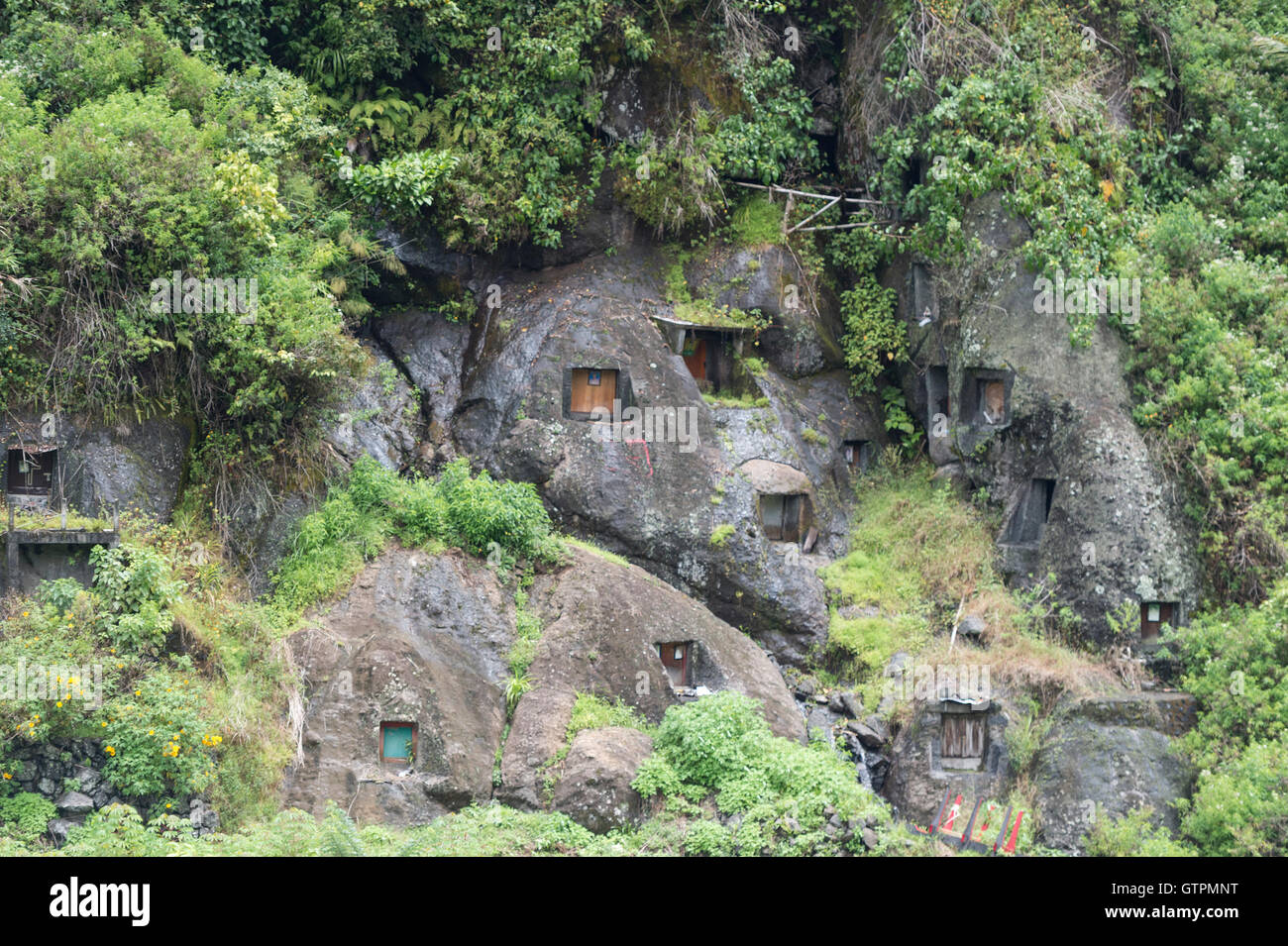 Buried In Rocks Stone Graveyard or burial site with coffins placed in caves carved into ...