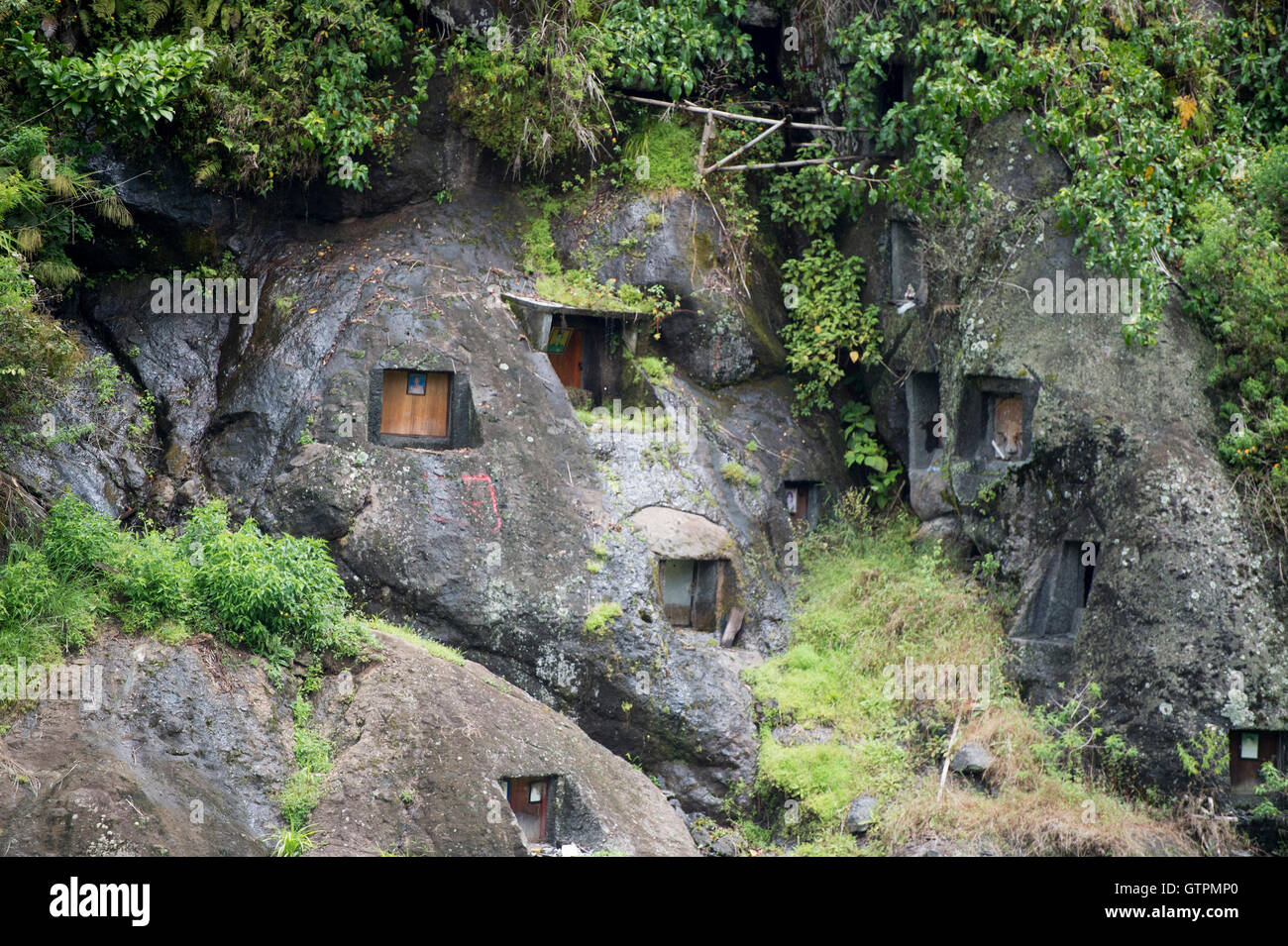 Buried In Rocks Stone Graveyard or burial site with coffins placed in caves carved into ...