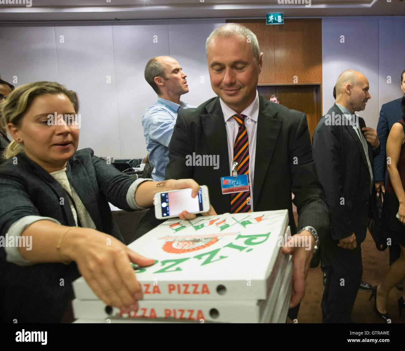 Geneva, Switzerland. 9th Sep, 2016. The press receive pizza from Russian Foreign Minister Sergey Lavrov as they've waited long for a new cessation of hostilities in Syria to be reached in Geneva, Switzerland, Sept. 9, 2016. U.S. Secretary of State John Kerry and Russian Foreign Minister Sergey Lavrov reached on Saturday a landmark agreement which would see both countries greatly enhance cooperation in a bid to end the five-year-old Syrian conflict. Credit:  Xu Jinquan/Xinhua/Alamy Live News Stock Photo