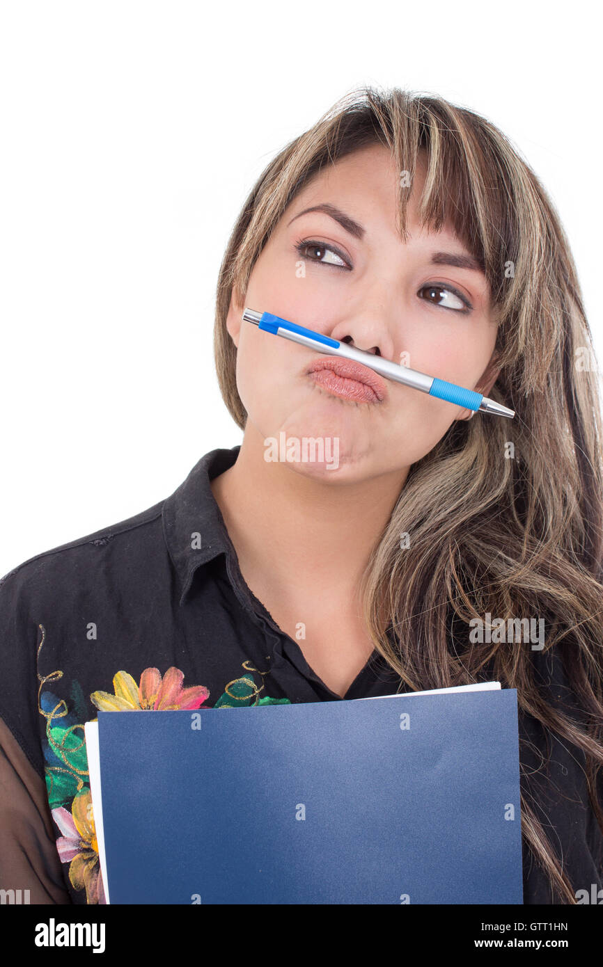 girl holding pen with her mouth Stock Photo - Alamy