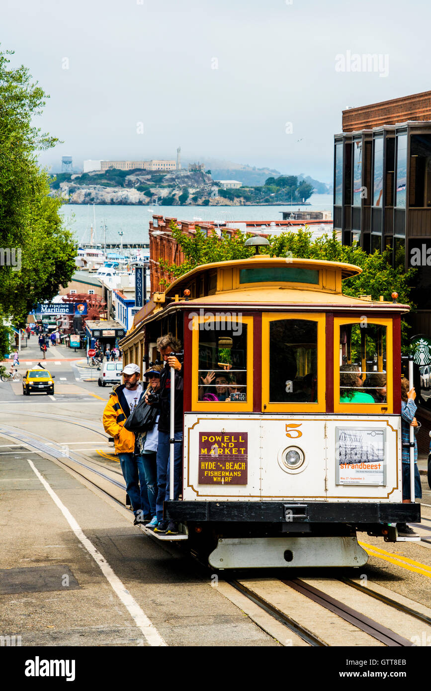 San Francisco cable car on Hyde street with Alcatraz in background