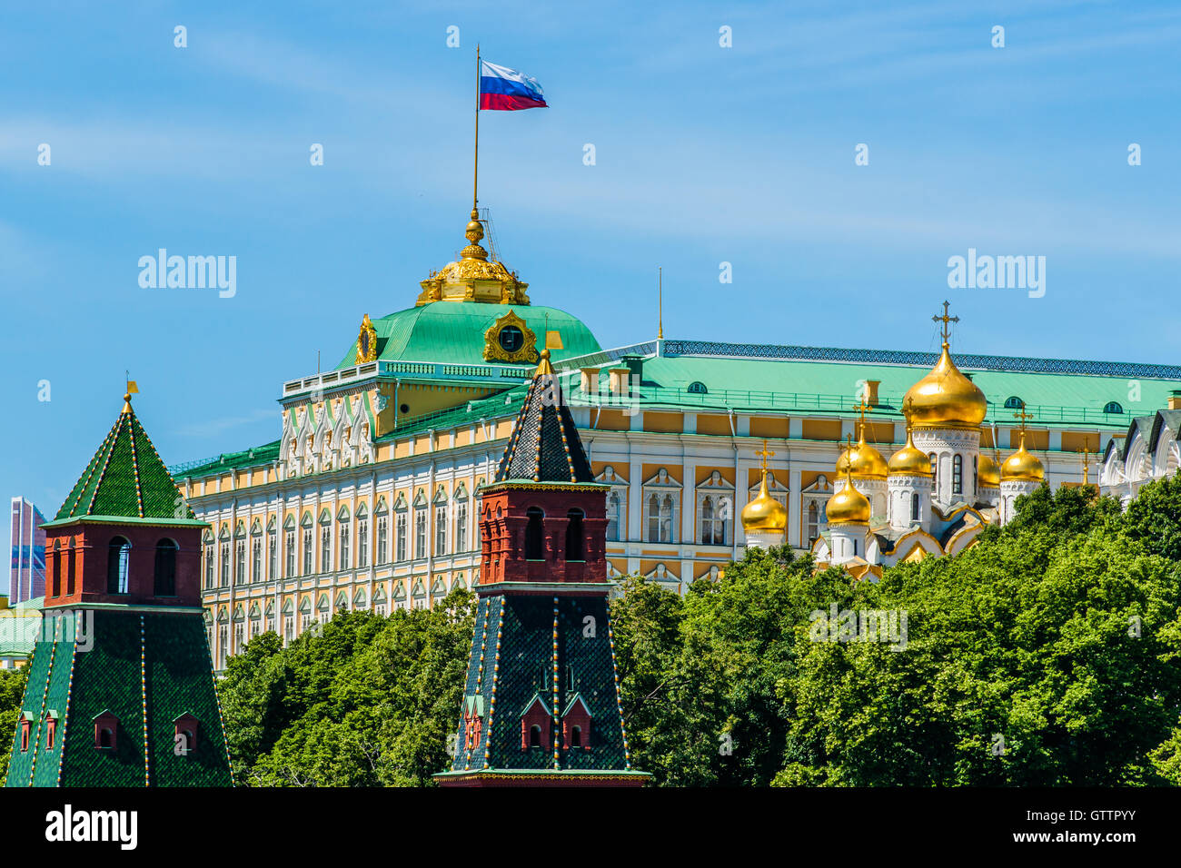 State Flag of the Russian Federation waves over the Grand Palace of Moscow Kremlin. Stock Photo